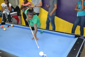 Taking a shot at pool.